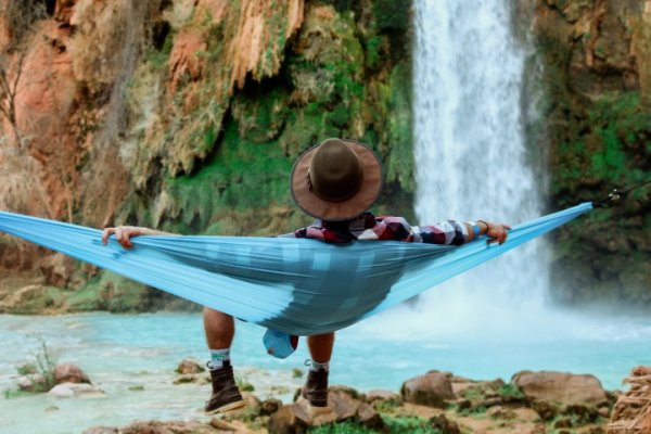 person relaxing on a hammock